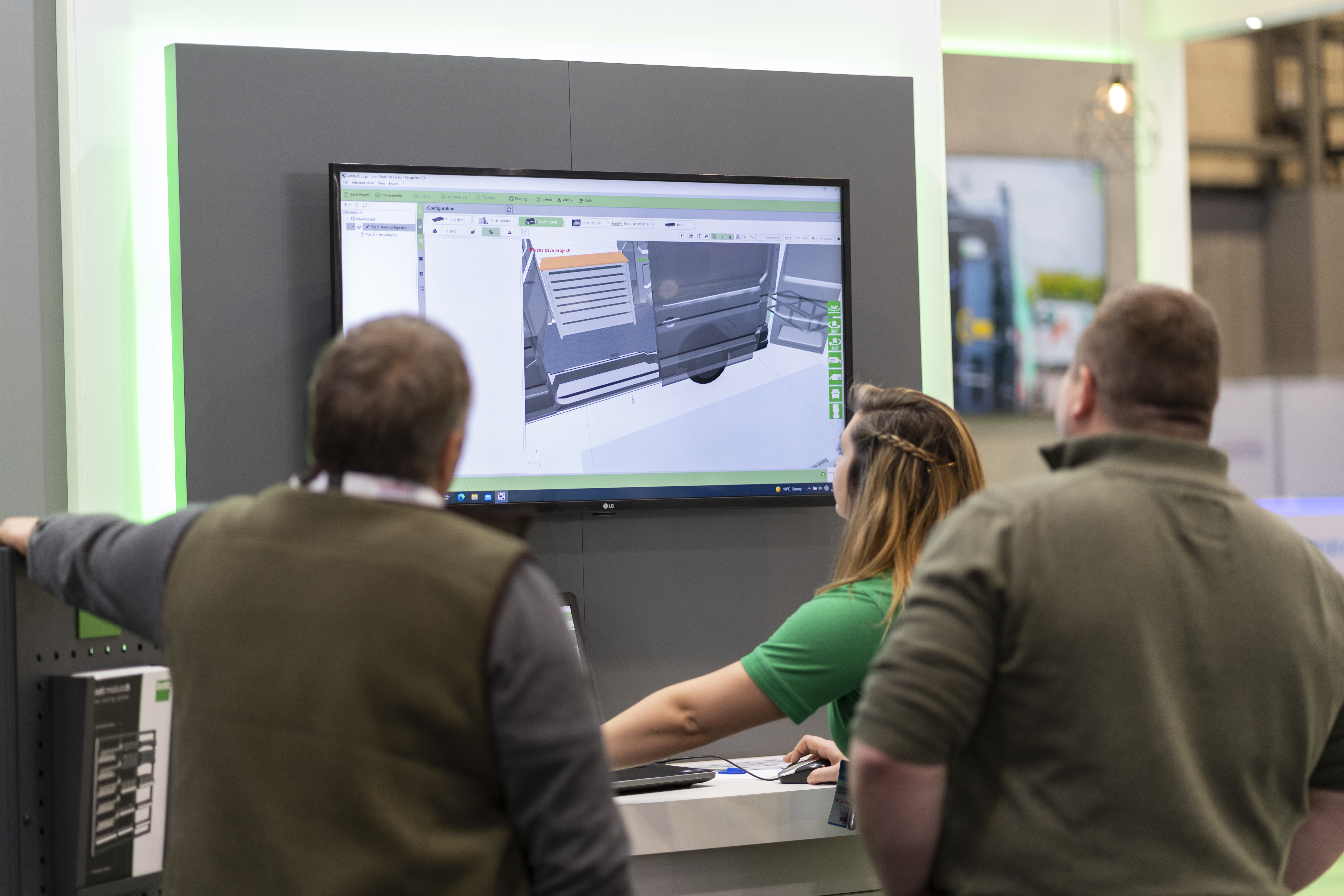 bott design expert guiding clients around 3d van racking model - custom van racking design