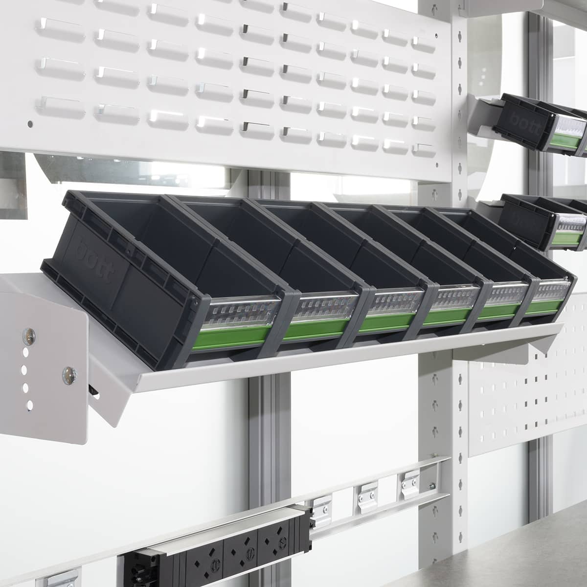 line up of bott boxes on white van racking shelving