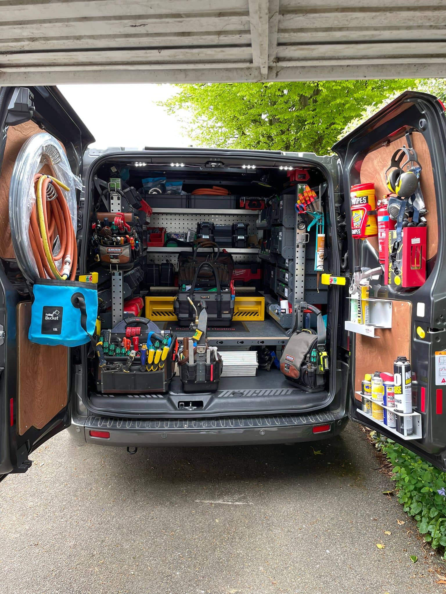 rear view of loaded van with van racking, van shelving and van false floor