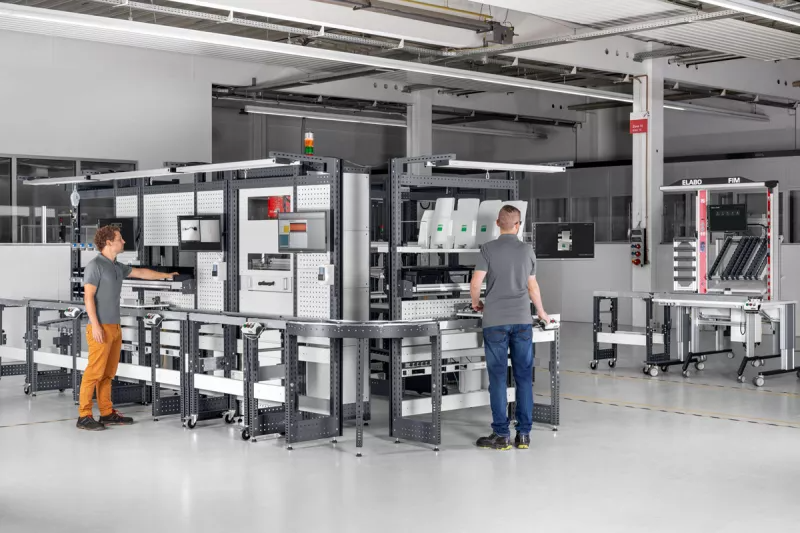 two bott engineers working on custom workplace storage system: avero