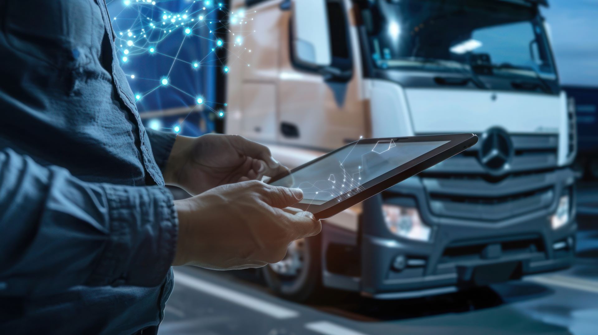 man-using-tablet-computer-truck-road-night-freight-transportation-concept.jpg