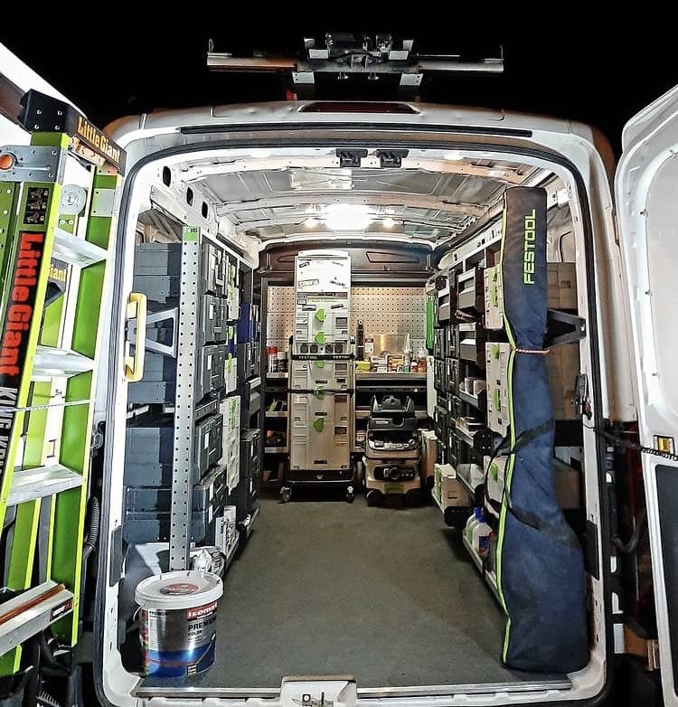 rear view of van with open doors and fitted with bott custom van racking & accessories including van shelving