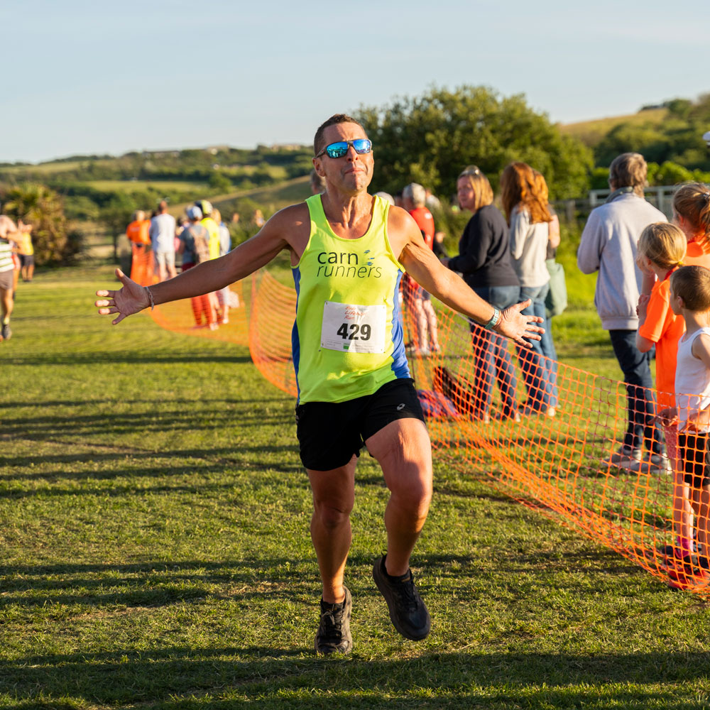 Bude Lifeboat Run man crossing finish line