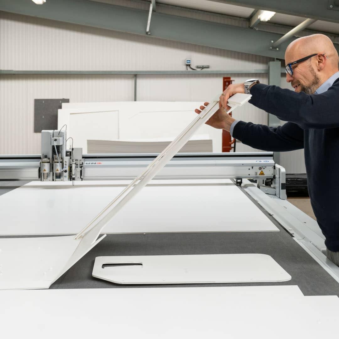 bott engineer lifting white bott workplace storage module